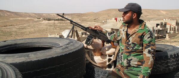 Syrian army soldiers at a checkpoint in the Syrian town of Maaloula, 55 km from Damascus, which was twice captured and looted by Jabhat al-Nusra militants Syrian army soldiers at a checkpoint in the Syrian town of Maaloula, 55 km from Damascus, which was twice captured and looted by Jabhat al-Nusra militants - Sputnik International