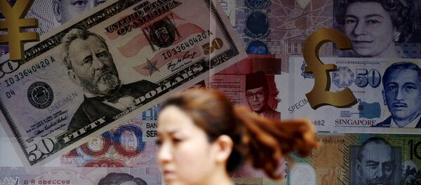 A woman walks past a money exchange shop in Kuala Lumpur, Malaysia, in this August 25, 2015 file photo A woman walks past a money exchange shop in Kuala Lumpur, Malaysia, in this August 25, 2015 file photo - Sputnik International
