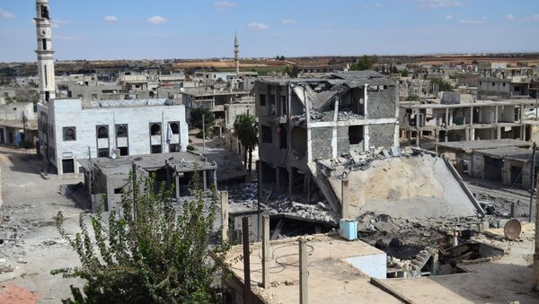 A picture taken on September 30, 2015 shows a general view of deserted streets and damaged buildings in the central Syrian town of Talbisseh in the Homs province - Sputnik International