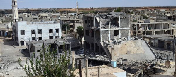 A picture taken on September 30, 2015 shows a general view of deserted streets and damaged buildings in the central Syrian town of Talbisseh in the Homs province A picture taken on September 30, 2015 shows a general view of deserted streets and damaged buildings in the central Syrian town of Talbisseh in the Homs province - Sputnik International