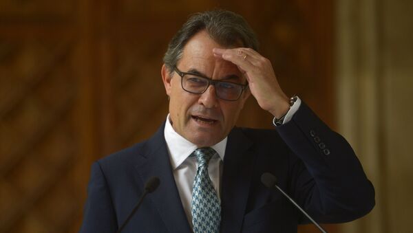 In this Tuesday, Oct. 14, 2014 file photo, Catalonia's regional president Artur Mas gestures during a press conference at the Generalitat Palace in Barcelona, Spain. Catalonia's acting regional president has been placed under investigation by a court for his role in staging a referendum on independence last year, officials said Tuesday Sept 29, 2015 - Sputnik International