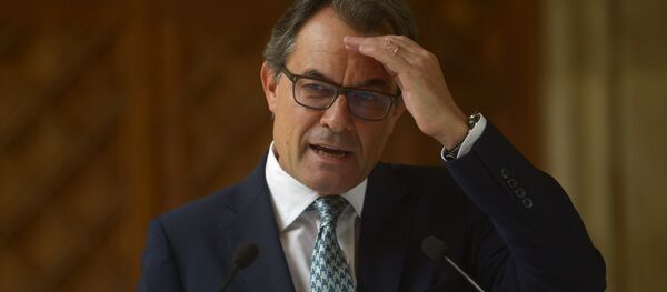 In this Tuesday, Oct. 14, 2014 file photo, Catalonia's regional president Artur Mas gestures during a press conference at the Generalitat Palace in Barcelona, Spain. Catalonia's acting regional president has been placed under investigation by a court for his role in staging a referendum on independence last year, officials said Tuesday Sept 29, 2015 - Sputnik International