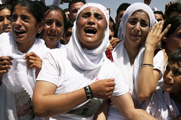 Yazidi Kurdish women chant slogans during a protest against the Islamic State group's invasion on Sinjar city, in Dohuk, northern Iraq, August 3, 2015. Yazidi Kurdish women chant slogans during a protest against the Islamic State group's invasion on Sinjar city, in Dohuk, northern Iraq, August 3, 2015. - Sputnik International