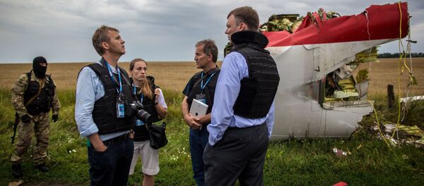 A search-and-rescue operation on the site of the MH17 plane crash in Ukraine's Donetsk region. File photo A search-and-rescue operation on the site of the MH17 plane crash in Ukraine's Donetsk region. File photo - Sputnik International