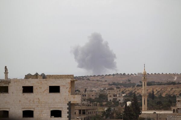 Smoke rises from a base controlled by rebel fighters from the Ahrar al-Sham Movement, that was targeted by what activists said were Russian airstrikes at Hass ancient cemeteries in the southern countryside of Idlib, Syria October 1, 2015. Smoke rises from a base controlled by rebel fighters from the Ahrar al-Sham Movement, that was targeted by what activists said were Russian airstrikes at Hass ancient cemeteries in the southern countryside of Idlib, Syria October 1, 2015. - Sputnik International