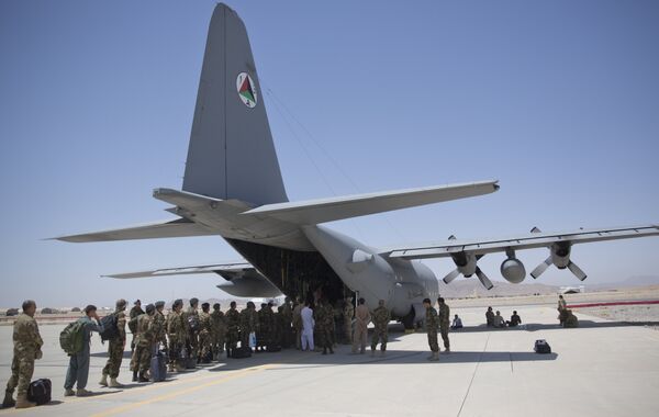 In this Tuesday, Aug. 18, 2015 photo, Afghan National Army soldiers line up to get into a C-130 Hercules, at Kandahar Air Base, in Kandahar, Afghanistan. In this Tuesday, Aug. 18, 2015 photo, Afghan National Army soldiers line up to get into a C-130 Hercules, at Kandahar Air Base, in Kandahar, Afghanistan. - Sputnik International