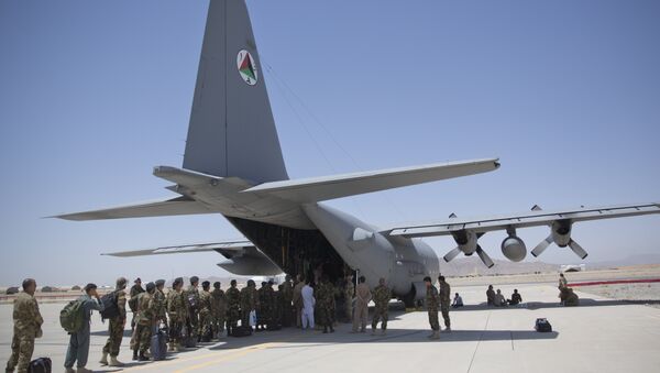 In this Tuesday, Aug. 18, 2015 photo, Afghan National Army soldiers line up to get into a C-130 Hercules, at Kandahar Air Base, in Kandahar, Afghanistan. - Sputnik International