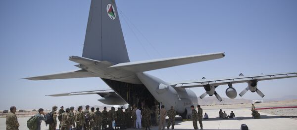In this Tuesday, Aug. 18, 2015 photo, Afghan National Army soldiers line up to get into a C-130 Hercules, at Kandahar Air Base, in Kandahar, Afghanistan. In this Tuesday, Aug. 18, 2015 photo, Afghan National Army soldiers line up to get into a C-130 Hercules, at Kandahar Air Base, in Kandahar, Afghanistan. - Sputnik International