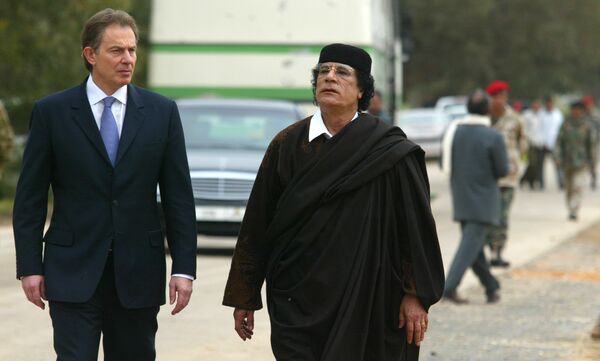 Libyan leader Col. Moammar Gadhafi, at right, with Britain's Prime Minister Tony Blair as they meet outside Tripoli, in Libya, Thursday, March, 25, 2004. Libyan leader Col. Moammar Gadhafi, at right, with Britain's Prime Minister Tony Blair as they meet outside Tripoli, in Libya, Thursday, March, 25, 2004. - Sputnik International