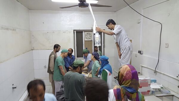 Afghan (MSF) surgeons work inside a Medecins Sans Frontieres (MSF) hospital after an air strike in the city of Kunduz, Afghanistan - Sputnik International