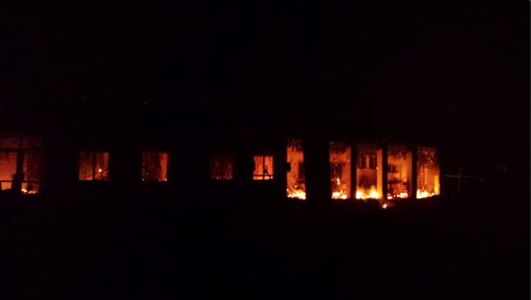 The Doctors Without Borders trauma center is seen in flames after explosions near their hospital, in the northern Afghan city of Kunduz - Sputnik International