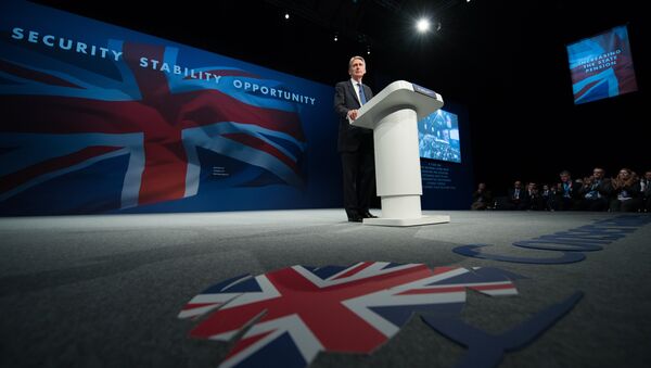 British Foreign Secretary Philip Hammond addresses delegates on the first day of the annual Conservative party conference in Manchester, north west England, on October 4, 2015. - Sputnik International