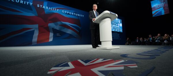 British Foreign Secretary Philip Hammond addresses delegates on the first day of the annual Conservative party conference in Manchester, north west England, on October 4, 2015. British Foreign Secretary Philip Hammond addresses delegates on the first day of the annual Conservative party conference in Manchester, north west England, on October 4, 2015. - Sputnik International