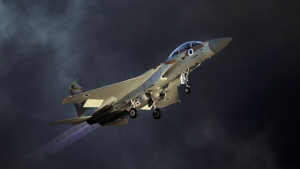An Israeli F-15 E fighter jet takes off during an air show as part of the graduation ceremony of Israeli pilots at the Hatzerim air force base in the southern Negev desert, near the city of Beersheva, on June 25, 2015 - Sputnik International