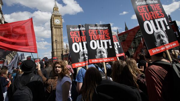 Protesters demonstrate against the Conservative government in Westminster, London, Saturday, May 9, 2015. David Cameron's Conservative Party swept to power Friday in Britain's Parliamentary General Elections, winning an unexpected majority. - Sputnik International