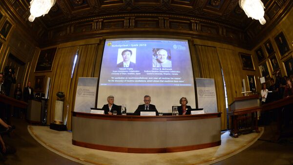 Anne L'Huillier, member of the Nobel Committee for Physics, Goran K Hansson, Permanent Secretary of the Royal Swedish Academy of Sciences, and Olga Botner, member of the Nobel Committee for Physics, sit in front of a screen displaying the winners of the Nobel Prize in Physics 2015 Takaaki Kajita (L) and Arthur B McDonald during a press conference of the Nobel Committee to announce the winners of the 2015 Nobel Prize in Physics on October 6, 2015 at the Swedish Academy of Sciences in Stockholm, Sweden - Sputnik International
