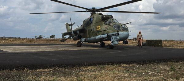 Ground crew servicing a Russian Mi-24 helicopter in Syria's Hmeymim airbase. Ground crew servicing a Russian Mi-24 helicopter in Syria's Hmeymim airbase. - Sputnik International
