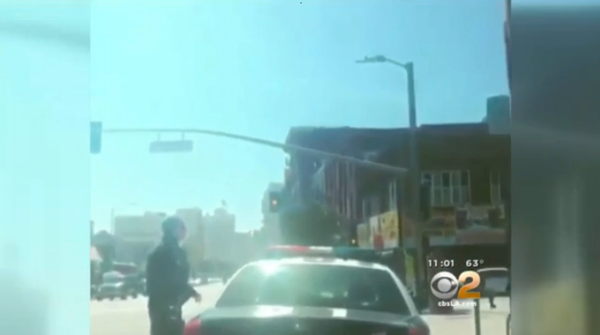 The video footage, posted on social media, begins with a Los Angeles police officer getting out of his patrol car, followed by a shot of a handgun held by a person watching the officer. The video footage, posted on social media, begins with a Los Angeles police officer getting out of his patrol car, followed by a shot of a handgun held by a person watching the officer. - Sputnik International
