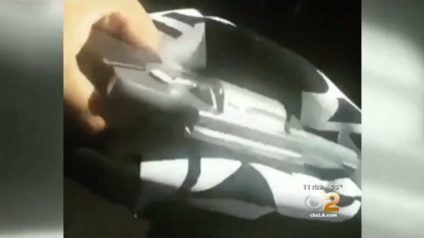 The video footage, posted on social media, begins with a Los Angeles police officer getting out of his patrol car, followed by a shot of a handgun held by a person watching the officer. The video footage, posted on social media, begins with a Los Angeles police officer getting out of his patrol car, followed by a shot of a handgun held by a person watching the officer. - Sputnik International