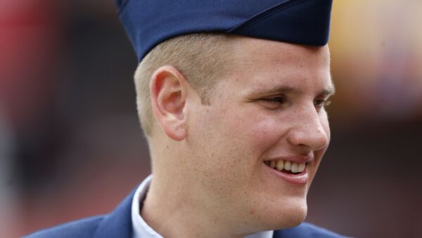 In this Sept. 20, 2015 file photo, US Air Force Airman 1st Class Spencer Stone walks along the sidelines before an NFL football game in Landover, Md. An Air Force spokesman said Thursday, Oct. 8, 2015, that Stone, who helped subdue an attacker on a Paris-bound train in August, is in stable condition after being stabbed in California. - Sputnik International