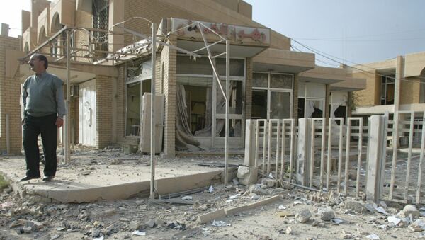 An Iraqi walks amid debris outside a maternity clinic in Baghdad after a US-British air raid 02 April 2003. The Red Crescent clinic was hit in air strikes over Baghdad this afternoon - Sputnik International