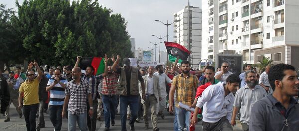 Demonstrators flood Martyrs' Square in Tripoli, 2013. - Sputnik International