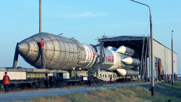 Proton-M space launch vehicle with an upper stage Breeze-M spacecraft and communication Sirius-5 being moved to the launch pad at Baikonur cosmodrome - Sputnik International