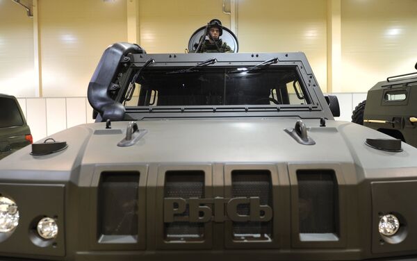 A serviceman in a light multirole armoured vehicle Rys at the exhibition Innovations Day of the Southern Military District in Rostov-on-Don. - Sputnik International