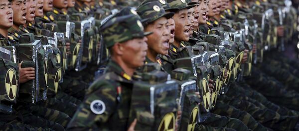 Soldiers shout slogans towards a stand with North Korean leader Kim Jong Un and other officials during the parade celebrating the 70th anniversary of the founding of the ruling Workers' Party of Korea, in Pyongyang October 10, 2015 - Sputnik International