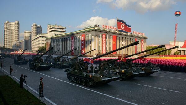 North Korean tanks pass through Kim Il-Sung square during a mass military parade in Pyongyang on October 10, 2015 - Sputnik International