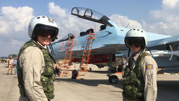 Russian pilots prepared to board the SU-30 attack plane to take off from the Hmeimim aerodrome in Syria. - Sputnik International
