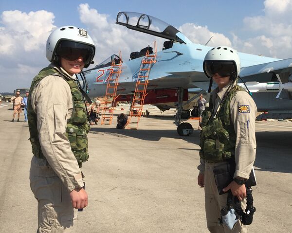 Russian pilots prepared to board the SU-30 attack plane to take off from the Hmeimim aerodrome in Syria. Russian pilots prepared to board the SU-30 attack plane to take off from the Hmeimim aerodrome in Syria. - Sputnik International
