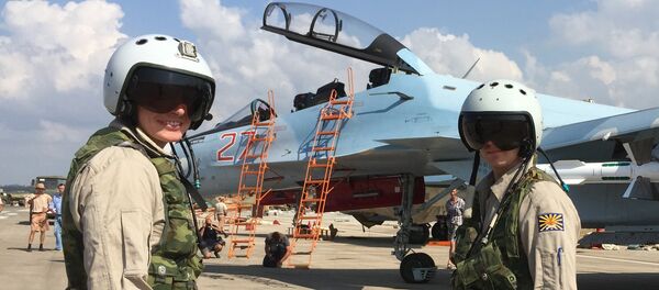 Russian pilots prepared to board the SU-30 attack plane to take off from the Hmeimim aerodrome in Syria. Russian pilots prepared to board the SU-30 attack plane to take off from the Hmeimim aerodrome in Syria. - Sputnik International