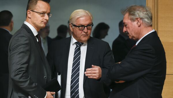 (LtoR) Hungary's Foreign Minister Janos Martonyi talks with German Foreign Minister Frank-Walter Steinmeier and Luxembourg's Foreign Minister Jean Asselborn during a EU Foreign Affairs Council meeting in Luxembourg on October 12, 2015. AFP PHOTO / JOHN THYS - Sputnik International