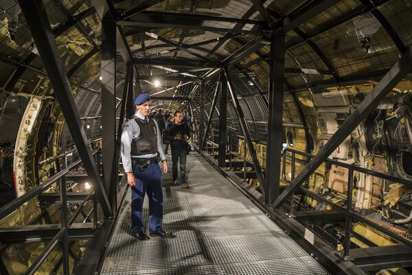 A military policeman stands guard in the reconstructed MH17 airplane after the presentation of the final report into the crash of July 2014 of Malaysia Airlines flight MH17 over Ukraine, in Gilze Rijen, the Netherlands, October 13, 2015 A military policeman stands guard in the reconstructed MH17 airplane after the presentation of the final report into the crash of July 2014 of Malaysia Airlines flight MH17 over Ukraine, in Gilze Rijen, the Netherlands, October 13, 2015 - Sputnik International