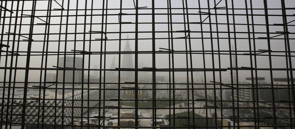 Al-Faisaliya tower is seen through metal bars from a nearby building under construction, during a sand storm in Riyadh, Saudi Arabia, Friday, April 25, 2015. Al-Faisaliya tower is seen through metal bars from a nearby building under construction, during a sand storm in Riyadh, Saudi Arabia, Friday, April 25, 2015. - Sputnik International