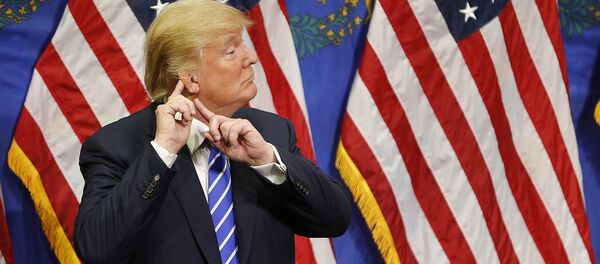 Republican presidential candidate Donald Trump reacts after speaking at a rally. - Sputnik International