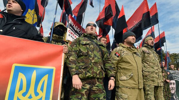 Members of far right movement Right Sector and supporters of nationalists parties wave flags as they attend a rally in Kiev on October 14, 2015 - Sputnik International