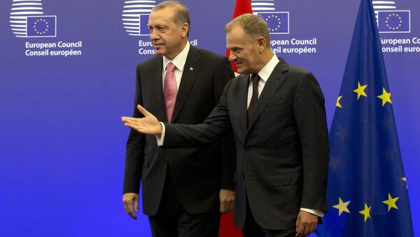 Turkish President Recep Tayyip Erdogan, left, is greeted by European Council President Donald Tusk prior to a meeting at the EU Council building in Brussels on Monday, Oct. 5, 2015. - Sputnik International
