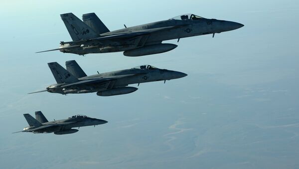 This US Air Forces Central Command file photo released by the Defense Video & Imagery Distribution System (DVIDS) shows a formation of US Navy F-18E Super Hornets in flight after receiving fuel from a KC-135 Stratotanker over northern Iraq, on September 23, 2014 - Sputnik International
