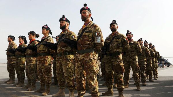 Italian soldiers stand to attention during a change of command ceremony at an Italian military camp near Herat airport - Sputnik International