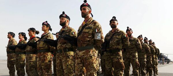 Italian soldiers stand to attention during a change of command ceremony at an Italian military camp near Herat airport. File photo - Sputnik International