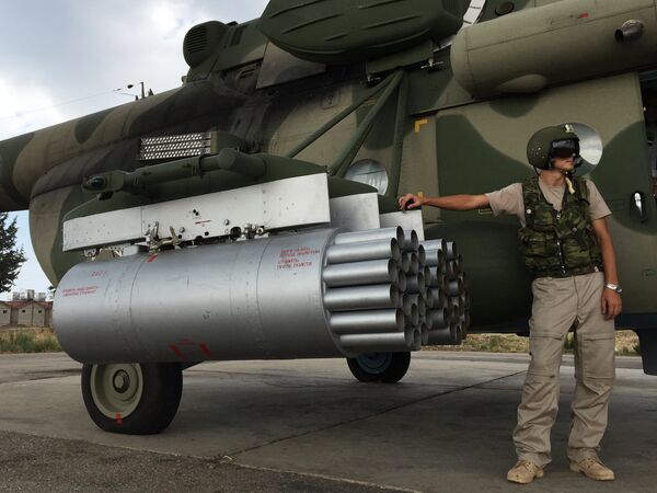 Pilot by a Russian MI-8AMShT cargo and attack helicopter at the Hmeimim air base in Syria. Pilot by a Russian MI-8AMShT cargo and attack helicopter at the Hmeimim air base in Syria. - Sputnik International