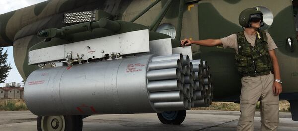 Pilot by a Russian MI-8AMShT cargo and attack helicopter at the Hmeimim air base in Syria. Pilot by a Russian MI-8AMShT cargo and attack helicopter at the Hmeimim air base in Syria. - Sputnik International