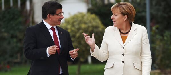 Turkish Prime Minister Ahmet Davutoglu (L) and German Chancellor Angela Merkel chat during their meeting in Istanbul, Turkey Turkish Prime Minister Ahmet Davutoglu (L) and German Chancellor Angela Merkel chat during their meeting in Istanbul, Turkey - Sputnik International