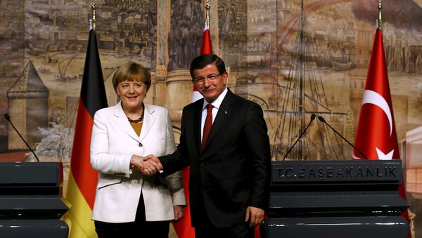 German Chancellor Angela Merkel meets Turkish Prime Minister Ahmet Davutoglu (R) in Istanbul, Turkey - Sputnik International