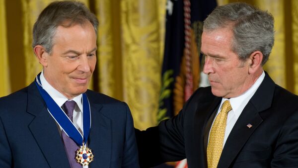 US President George W. Bush presents the Presidential Medal of Freedom to former British Prime Minister Tony Blair (L) in the East Room of the White House in Washington. (File) - Sputnik International