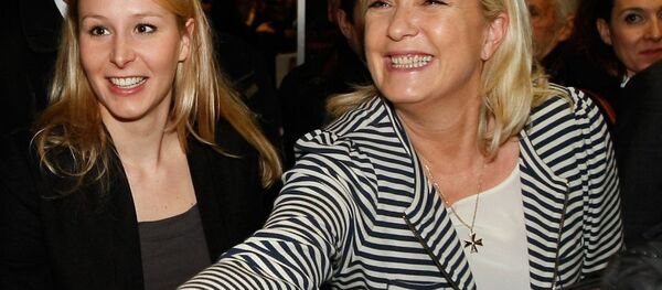 French far-right Front National leader Marine Le Pen, right, and her niece Front National Deputy Marion Marechal Le Pen, center. French far-right Front National leader Marine Le Pen, right, and her niece Front National Deputy Marion Marechal Le Pen, center. - Sputnik International
