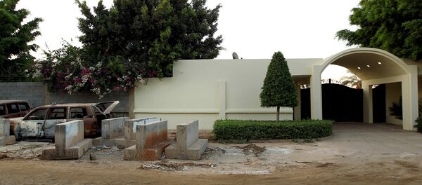 A picture taken on September 10, 2013 shows the wreckage of burnt cars outside the main gate of the US consulate in Benghazi on the eve of the anniversary of the 2012 attack on the diplomatic mission that left four people dead, including the ambassador. A picture taken on September 10, 2013 shows the wreckage of burnt cars outside the main gate of the US consulate in Benghazi on the eve of the anniversary of the 2012 attack on the diplomatic mission that left four people dead, including the ambassador. - Sputnik International