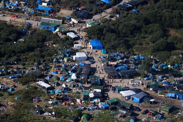 An aerial view of the migrant camp known as the New Jungle Camp, near to Calais, northern France, Friday, Sept. 25, 2015. An aerial view of the migrant camp known as the New Jungle Camp, near to Calais, northern France, Friday, Sept. 25, 2015. - Sputnik International